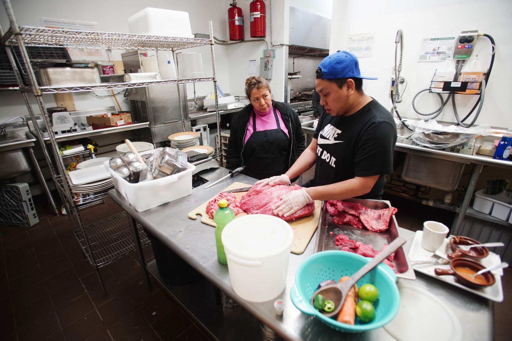 Maria Romero Valdez supervises preparation for the opening of Placita Latina